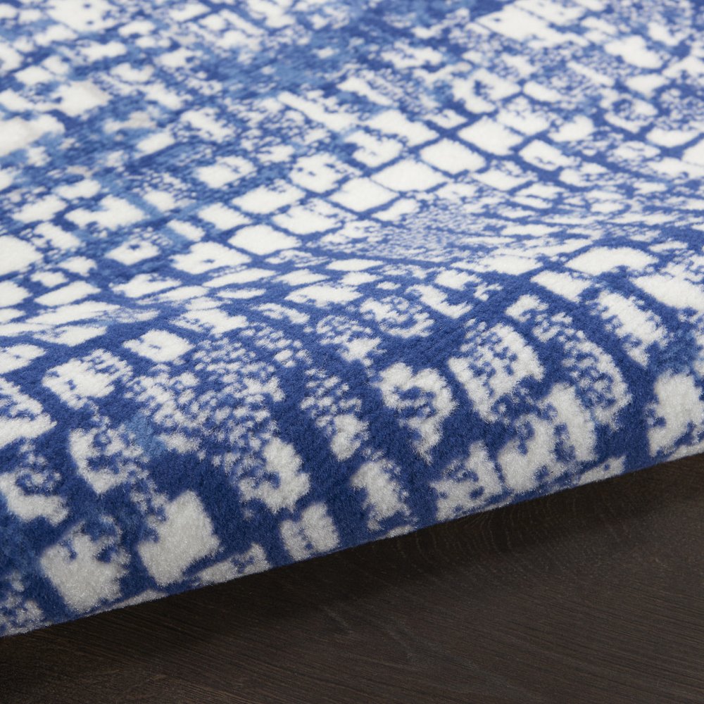 5' X 7' Ivory And Blue Geometric Area Rug