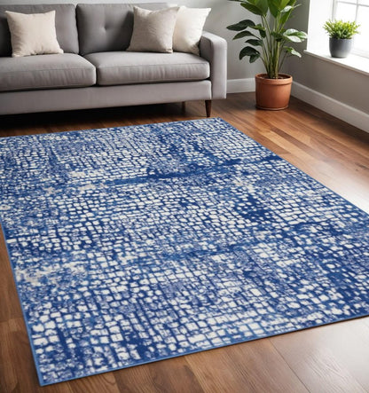6' X 9' Ivory And Blue Geometric Area Rug