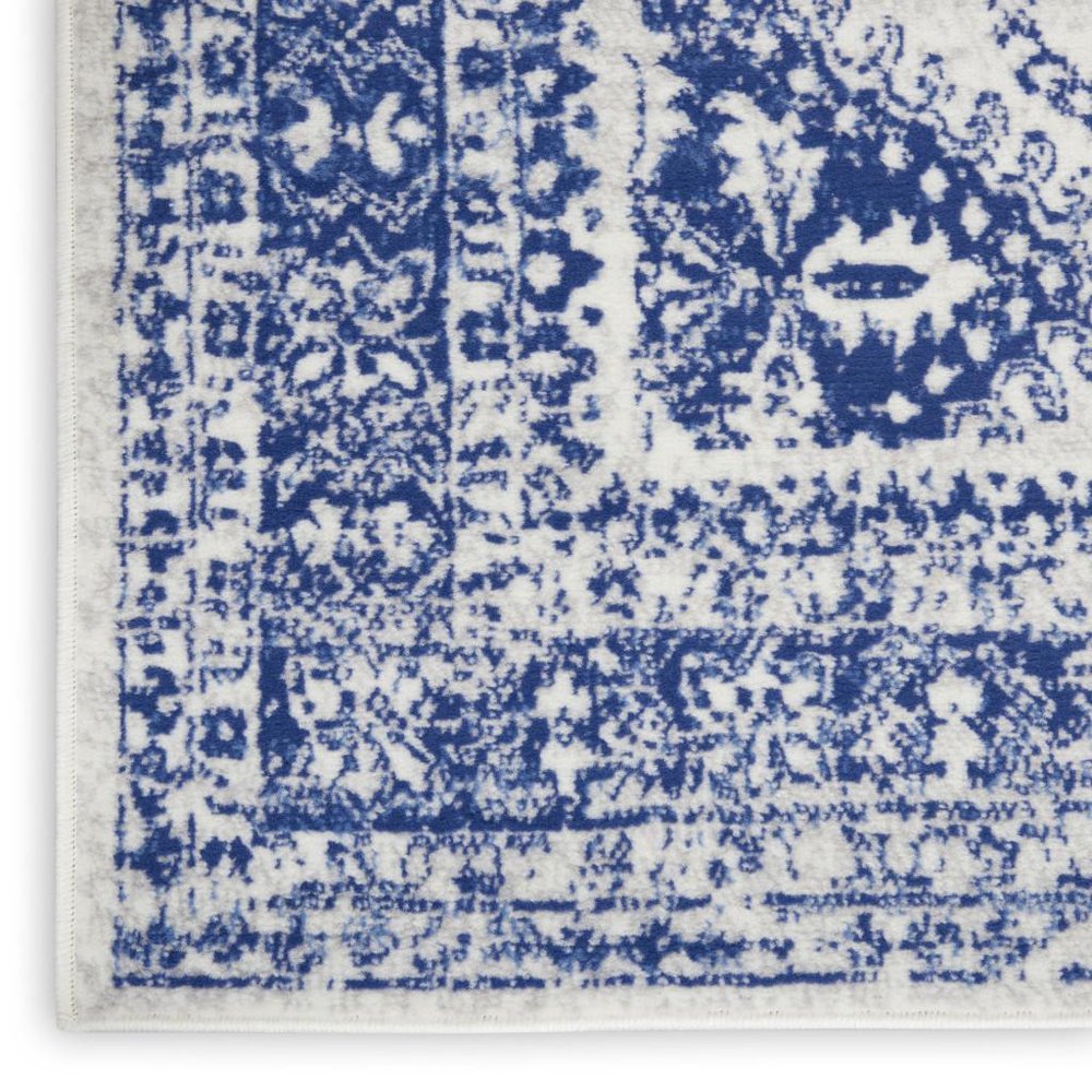 5' X 7' Ivory And Blue Geometric Distressed Area Rug