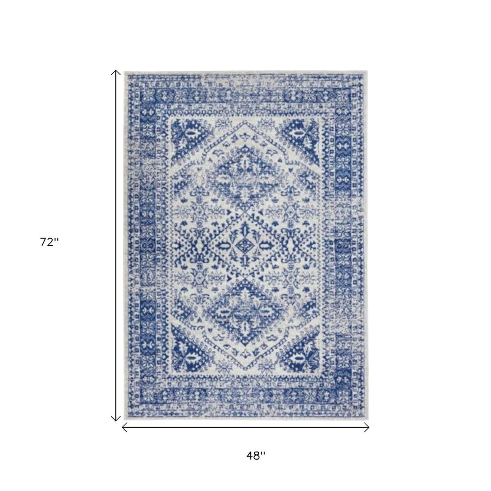 4' X 6' Ivory And Blue Geometric Distressed Area Rug