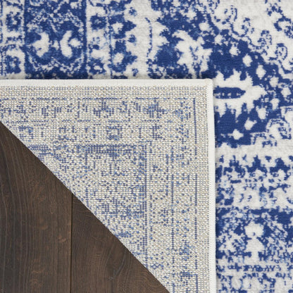 5' X 7' Ivory And Blue Geometric Distressed Area Rug
