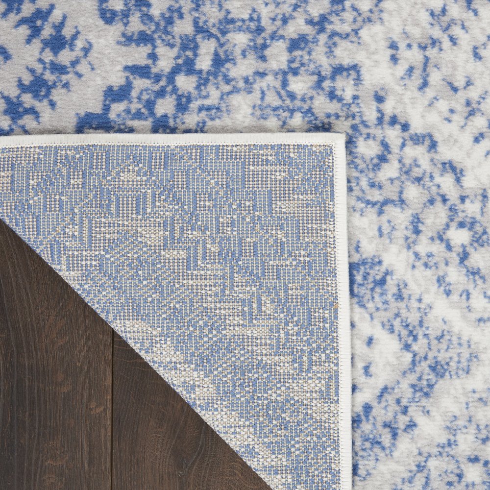 6' X 9' Ivory And Blue Geometric Area Rug