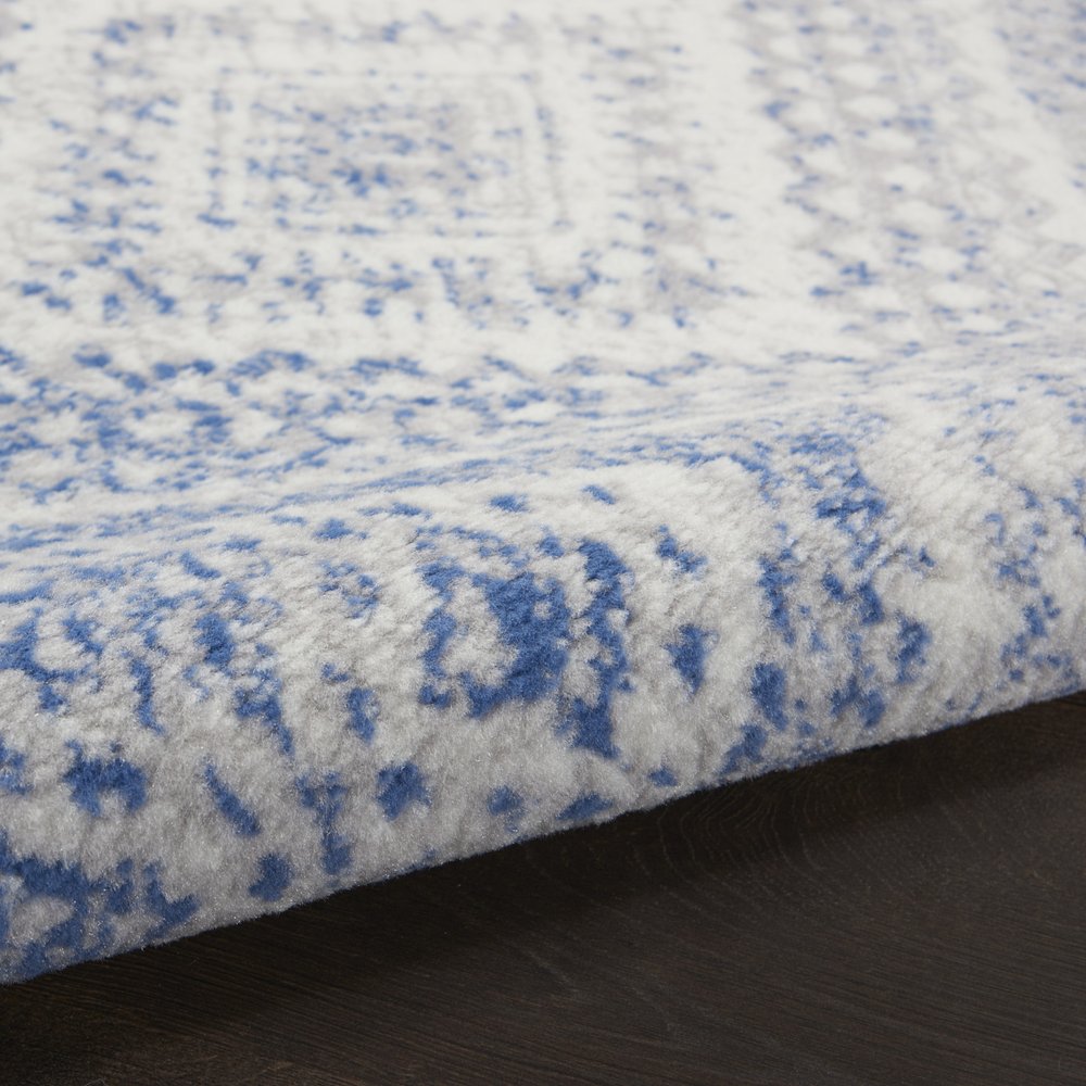 6' X 9' Ivory And Blue Geometric Area Rug