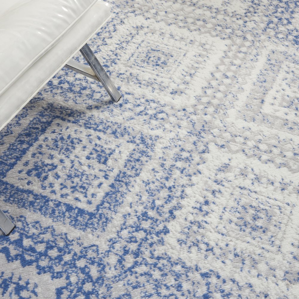 6' X 9' Ivory And Blue Geometric Area Rug