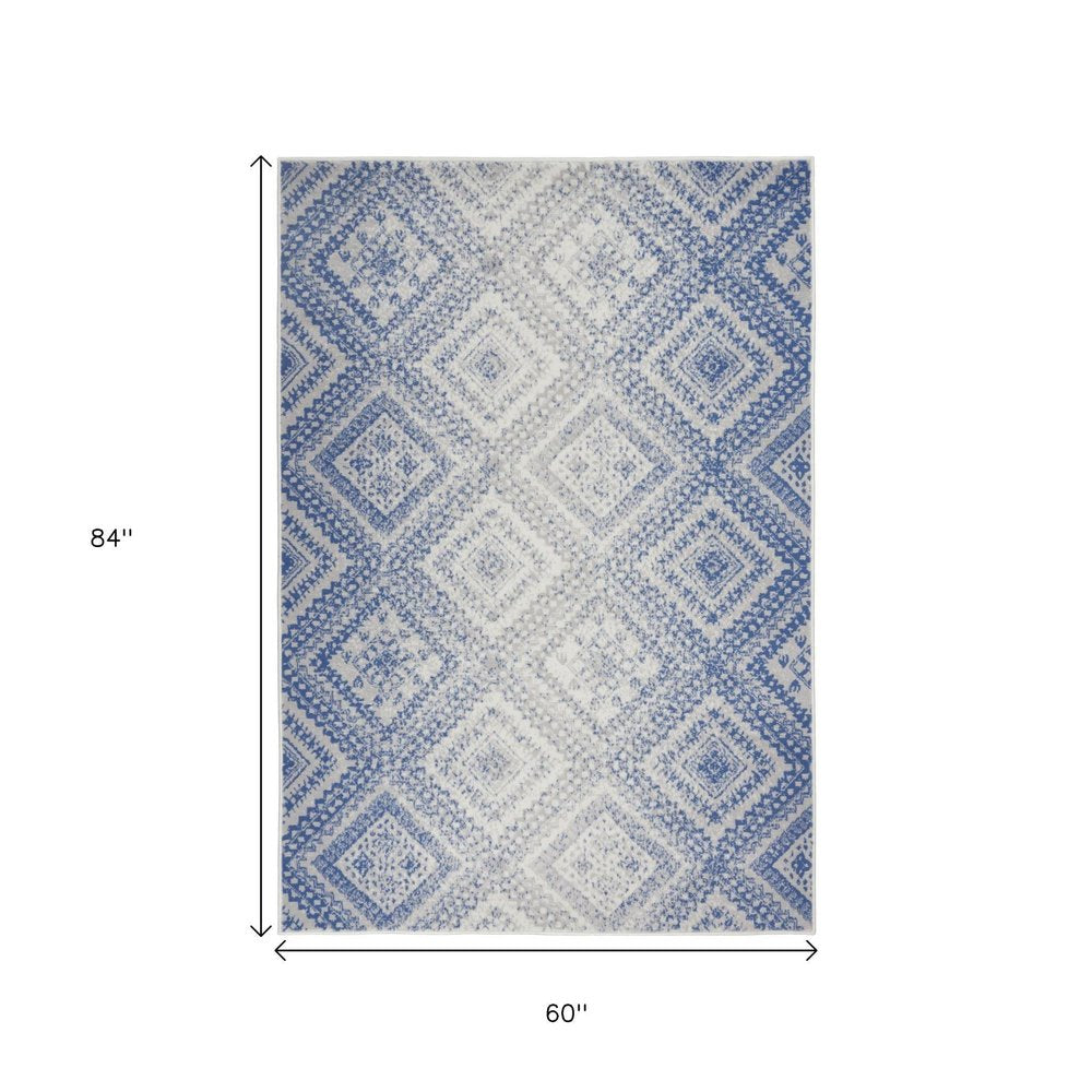 6' X 9' Ivory And Blue Geometric Area Rug
