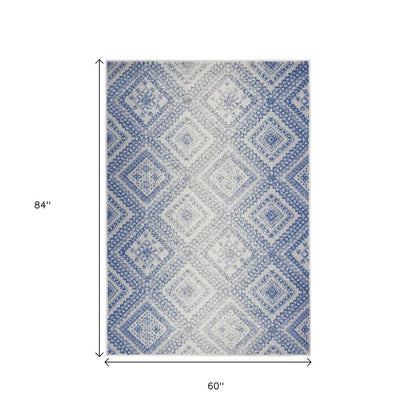 6' X 9' Ivory And Blue Geometric Area Rug