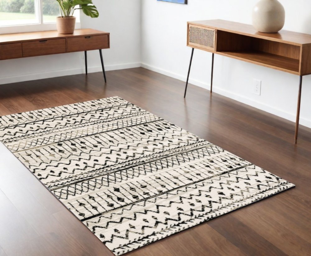 7' X 9' Ivory And Black Abstract Geometric Area Rug