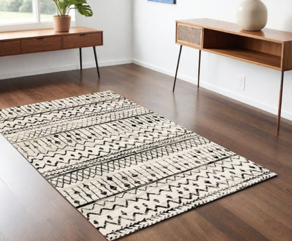 7' X 9' Ivory And Black Abstract Geometric Area Rug