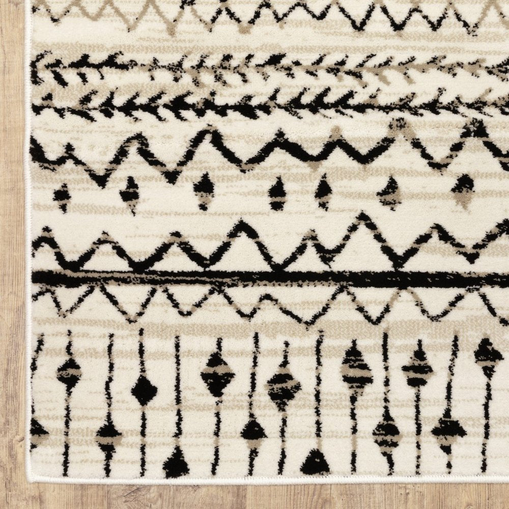 7' X 9' Ivory And Black Abstract Geometric Area Rug