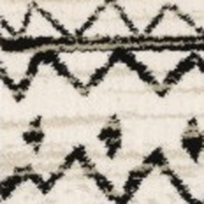 7' X 9' Ivory And Black Abstract Geometric Area Rug