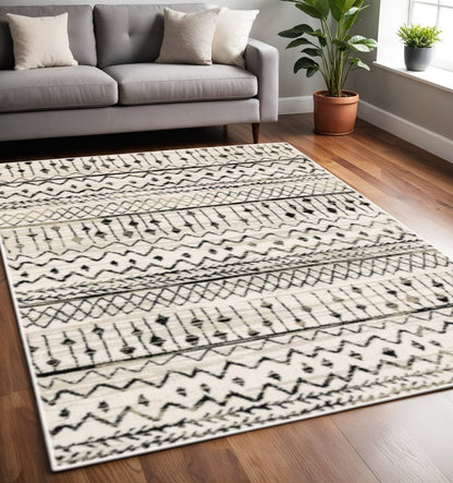 7' X 9' Ivory And Black Abstract Geometric Area Rug
