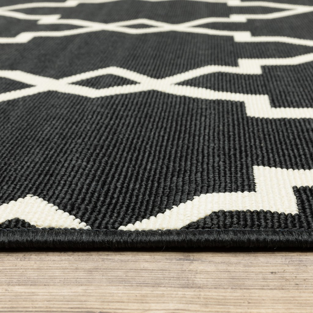 2' X 8' Black and Ivory Indoor Outdoor Area Rug