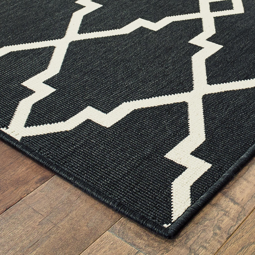 2' X 8' Black and Ivory Indoor Outdoor Area Rug