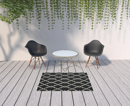 2' X 8' Black and Ivory Indoor Outdoor Area Rug