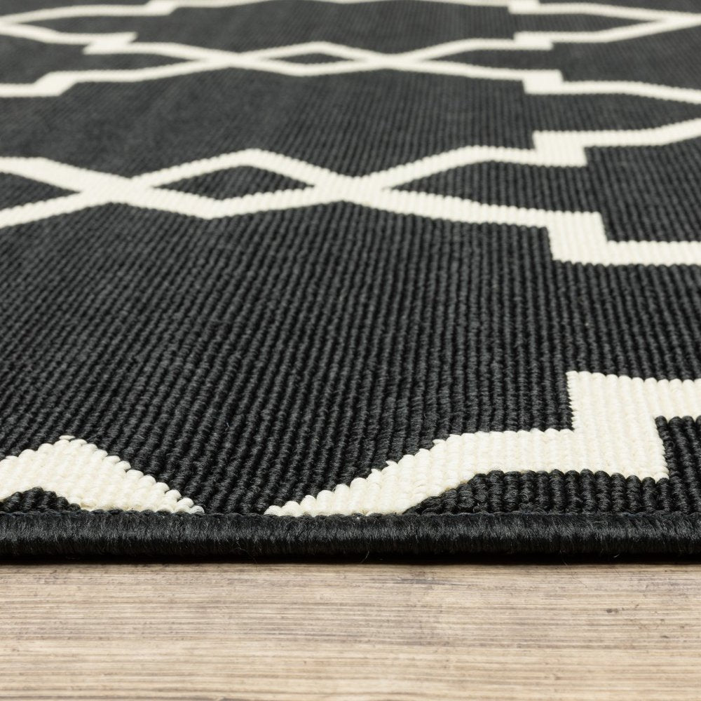 2' X 4' Black And Ivory Indoor Outdoor Area Rug