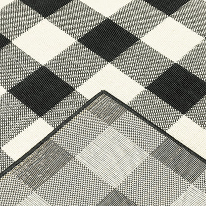 2' X 4' Black and Ivory Indoor Outdoor Area Rug