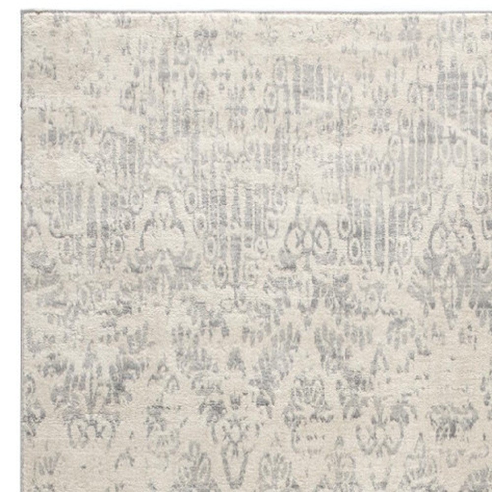 5' X 8' Ivory Distressed Ikat Pattern Area Rug