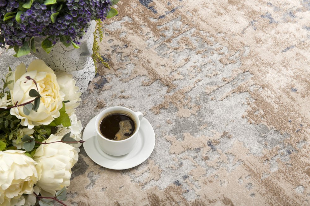 7' X 10' Beige And Ivory Abstract Area Rug