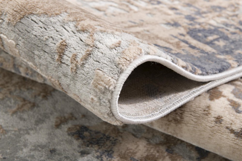 7' X 10' Beige And Ivory Abstract Area Rug