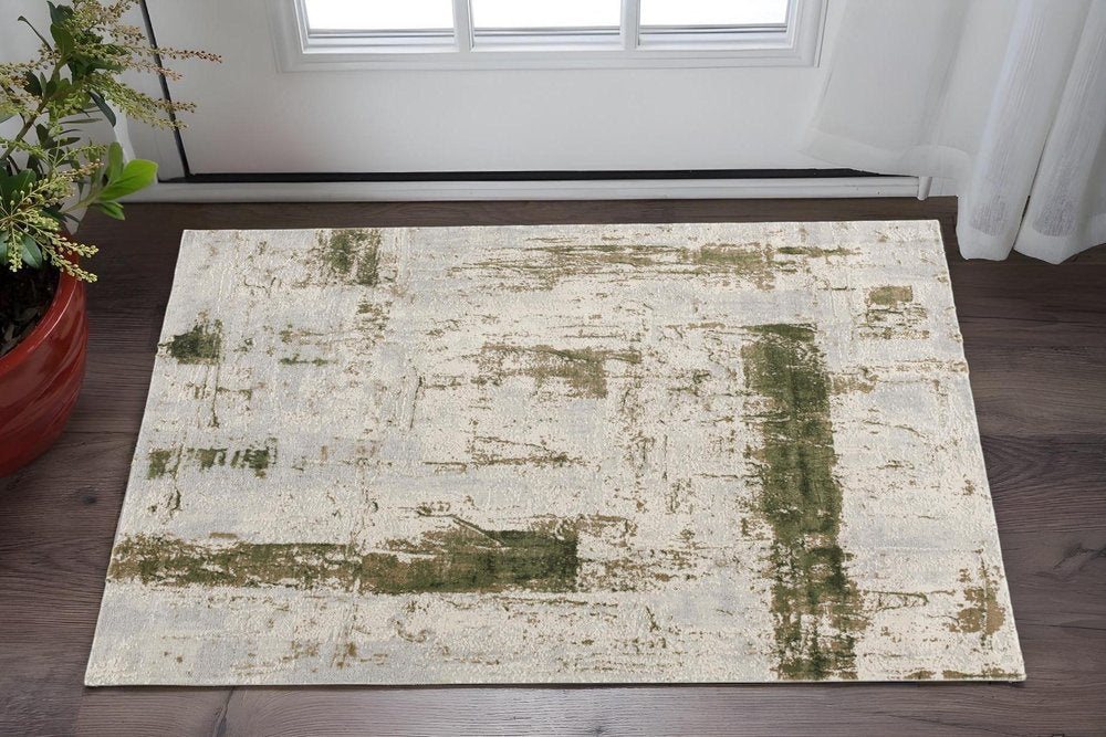 5' X 7' Green And Ivory Abstract Area Rug