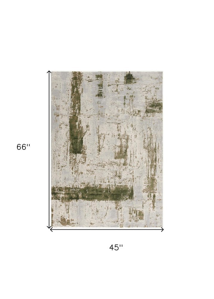 5' X 7' Green And Ivory Abstract Area Rug