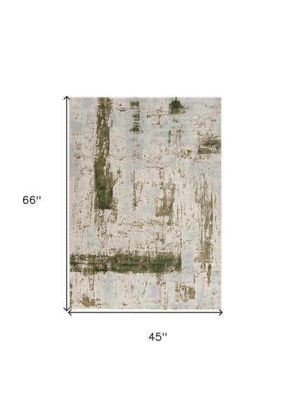 5' X 7' Green And Ivory Abstract Area Rug