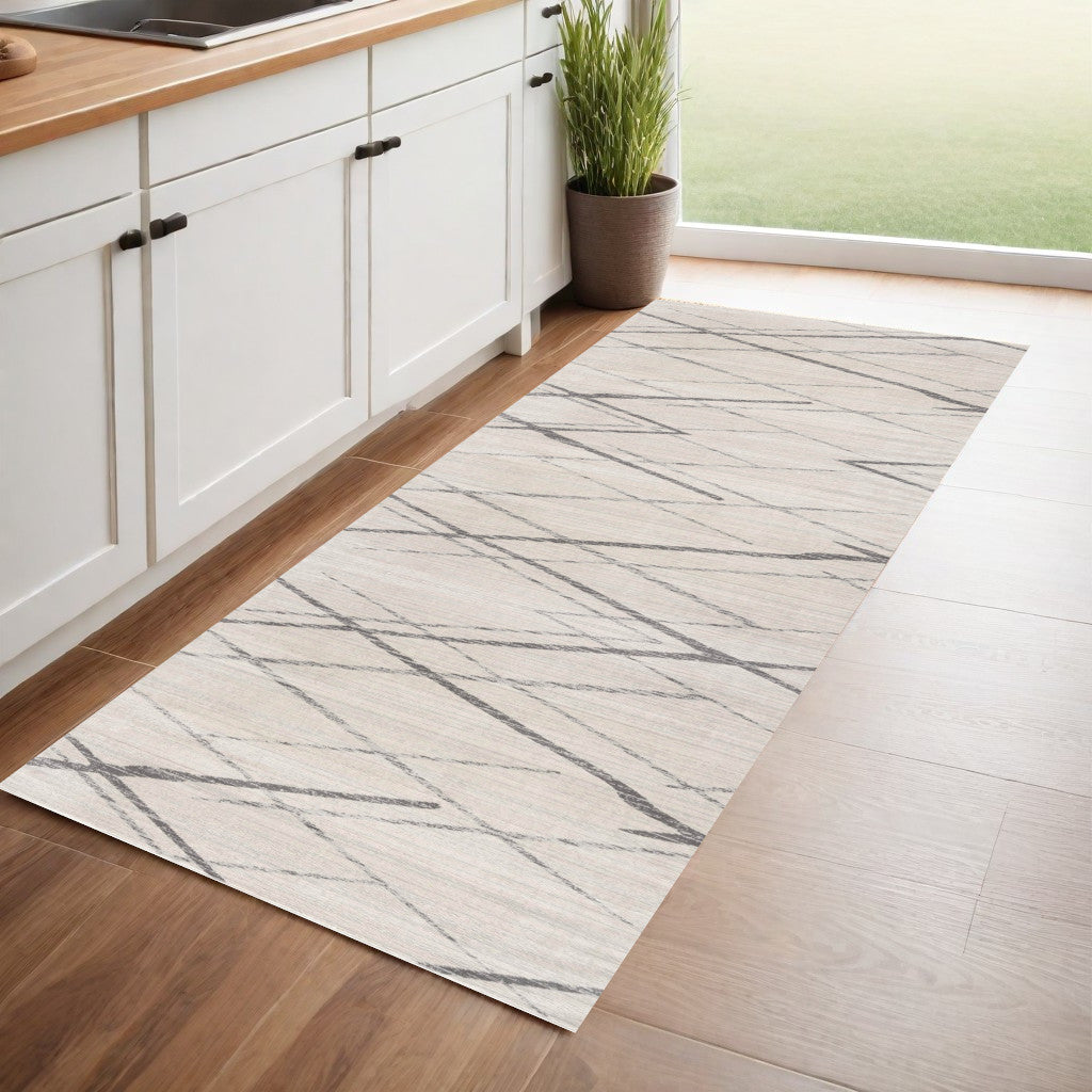 2' X 4' Gray and Ivory Geometric Area Rug