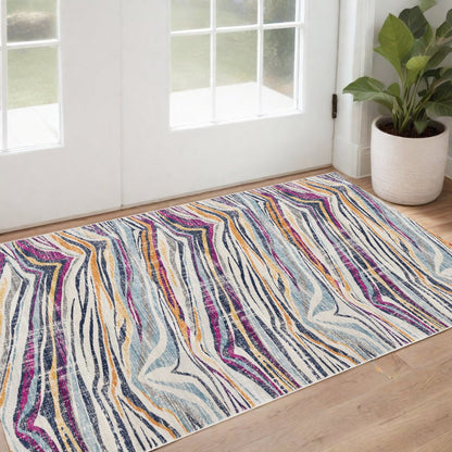 2' X 4' Blue and Gold Abstract Area Rug