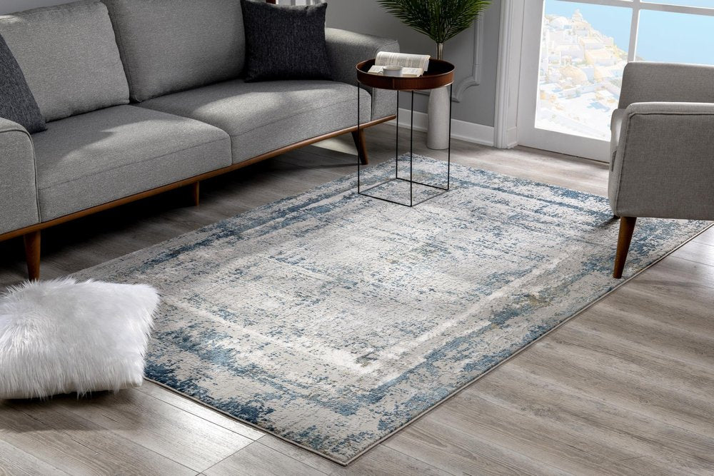 4' X 6' Blue and Ivory Abstract Power Loom Area Rug