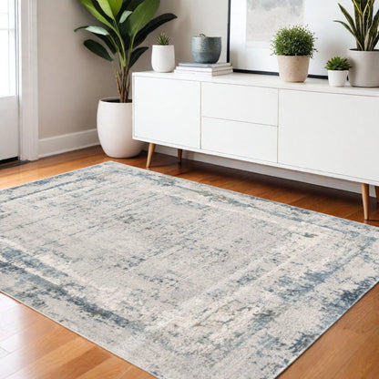 4' X 6' Blue and Ivory Abstract Power Loom Area Rug