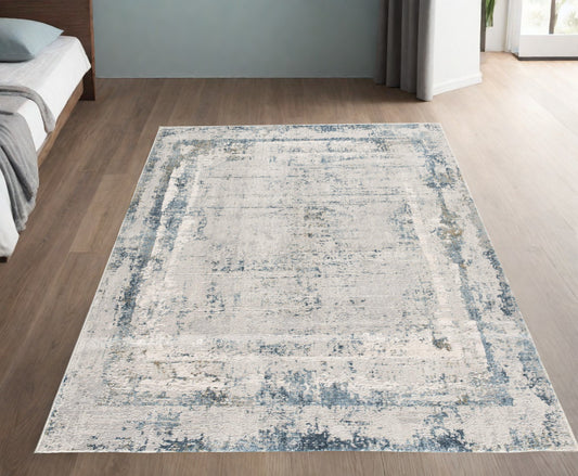 4' X 6' Blue and Ivory Abstract Power Loom Area Rug