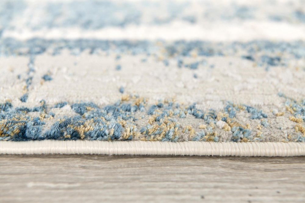 4' X 6' Blue and Ivory Abstract Power Loom Area Rug