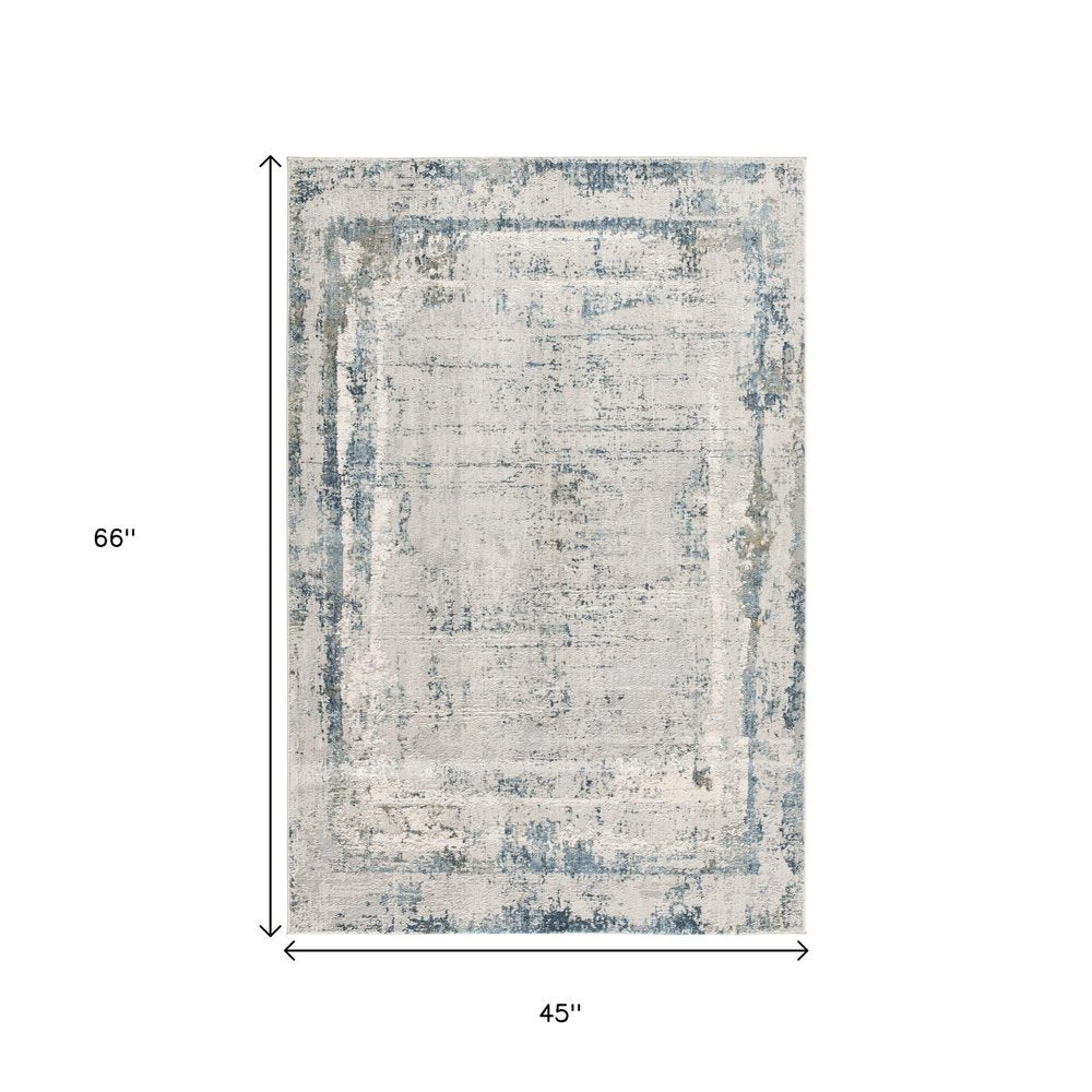 4' X 6' Blue and Ivory Abstract Power Loom Area Rug