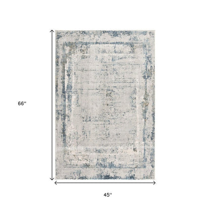 4' X 6' Blue and Ivory Abstract Power Loom Area Rug