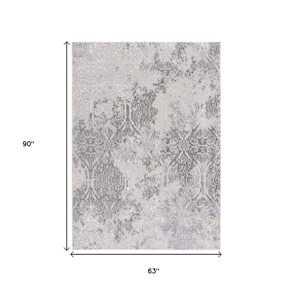 8' X 11' Cream And Gray Tinted Ogee Pattern Area Rug