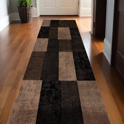 6' X 9' Black And Brown Geometric Distressed Area Rug