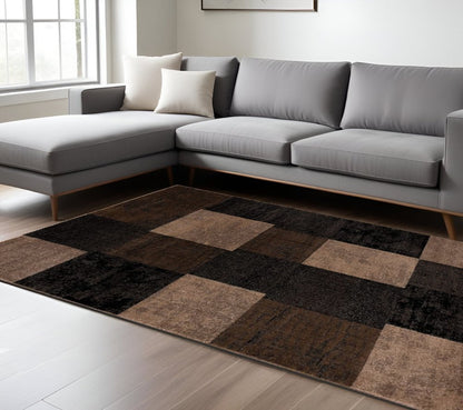 6' X 9' Black And Brown Geometric Distressed Area Rug