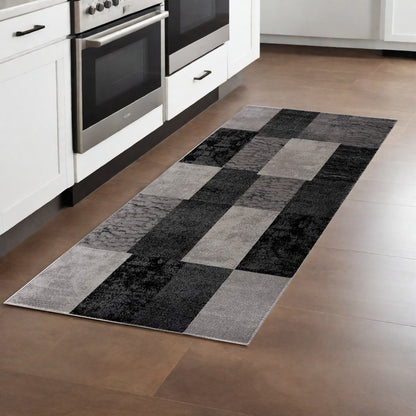6' X 9' Black And Gray Geometric Distressed Area Rug