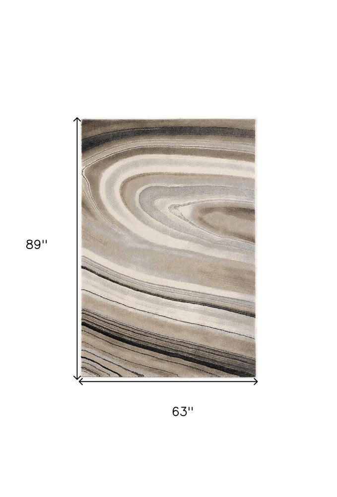 7' X 10' Cream and Tan Abstract Marble Area Rug