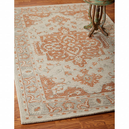 5' X 8' Orange and Ivory Medallion Area Rug