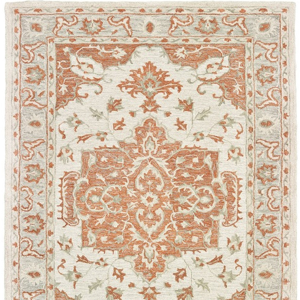 5' X 8' Orange and Ivory Medallion Area Rug