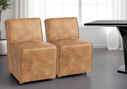 Set of Two Brown Upholstered Faux Leather Dining Side Chairs With Wheels