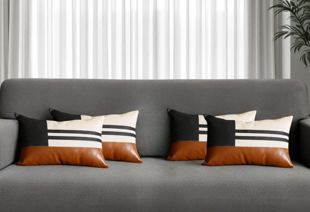Set of Four 12" X 20" Brown Black and Ivory Striped Fabric and Faux Leather Lumbar Throw Pillows