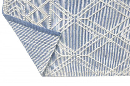 5' X 7' Blue and Ivory Geometric Handmade Area Rug