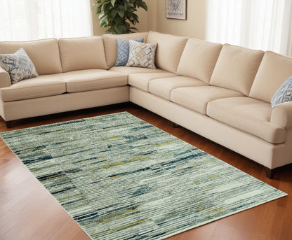 9' X 13' Ivory and Blue Abstract Area Rug