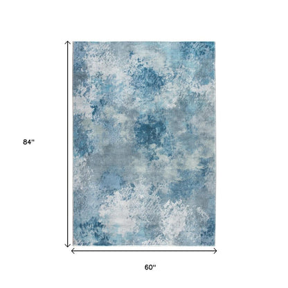 5' X 8' Blue And Ivory Abstract Area Rug