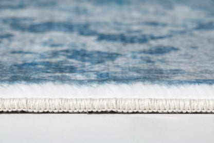 5' X 8' Blue And Ivory Abstract Area Rug