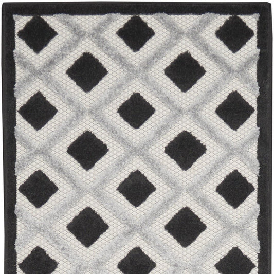 10' Black And White Indoor Outdoor Runner Rug