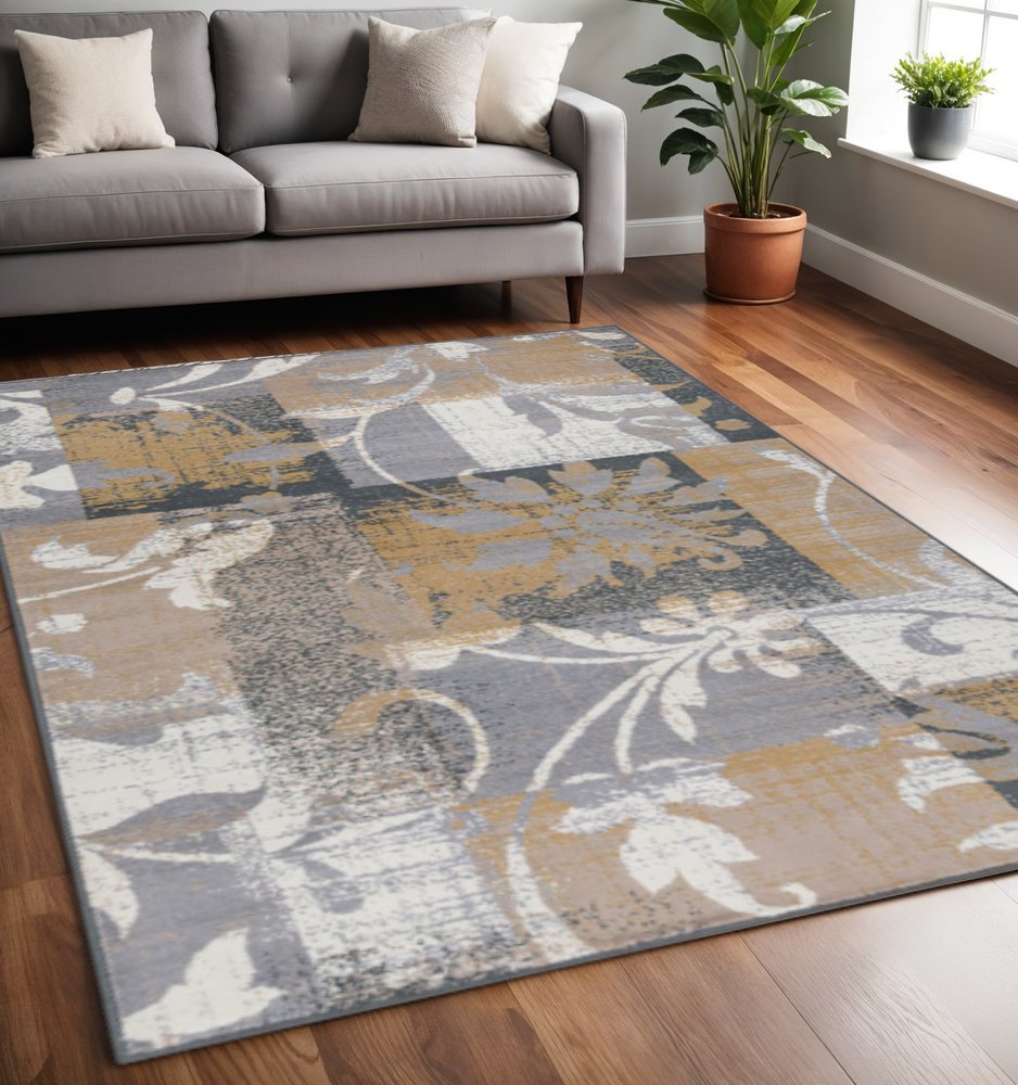 5' X 8' Beige And Black Floral Distressed Area Rug