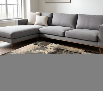 6' X 9' Beige Brown And Gray Floral Distressed Area Rug